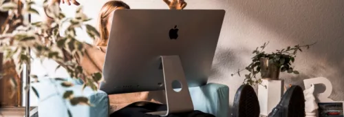 Women with iMac on lap