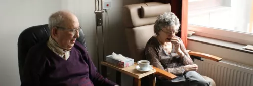 Elderly people in chairs