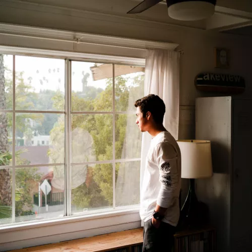 Man standing near window