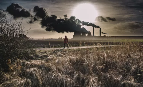 Person Walking Near A Factory