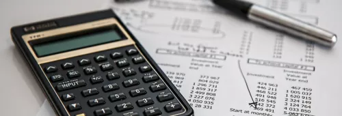 Calculator and sheets of paper