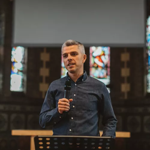 Peter holding microphone