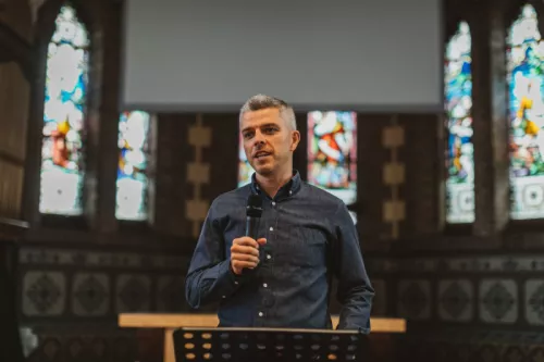 Peter holding microphone