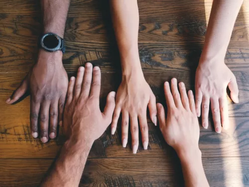 Five human hands