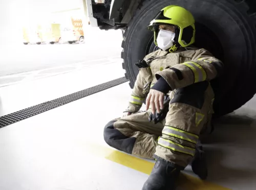 Firefighter leaning wheel