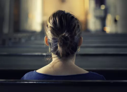 Woman visiting Christian church edited