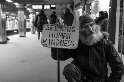 Man With Sign Asking For Human Kindness