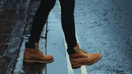 Stepping out image feet crossing road