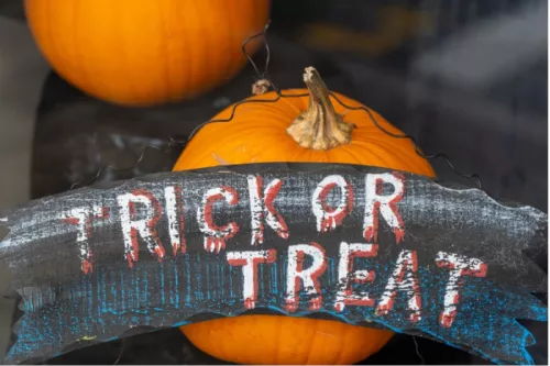 Halloween pumpkins and a trick or treat sign