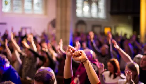 Worshippers raising hands in church idea jan 2023