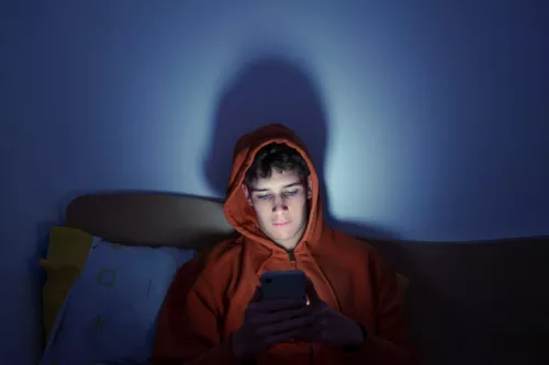 Boy on phone texting