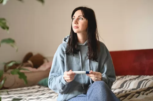 Young woman with pregnancy test